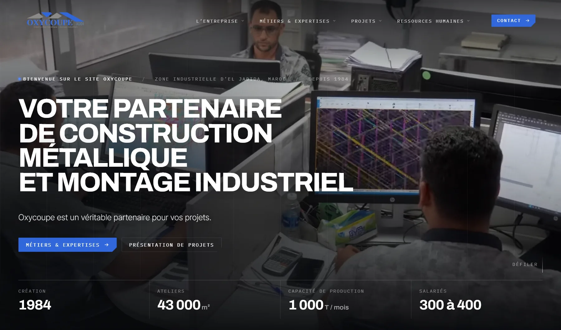 Oxycoupe website: “Votre partenaire de construction métallique et montage industriel” over an engineering office